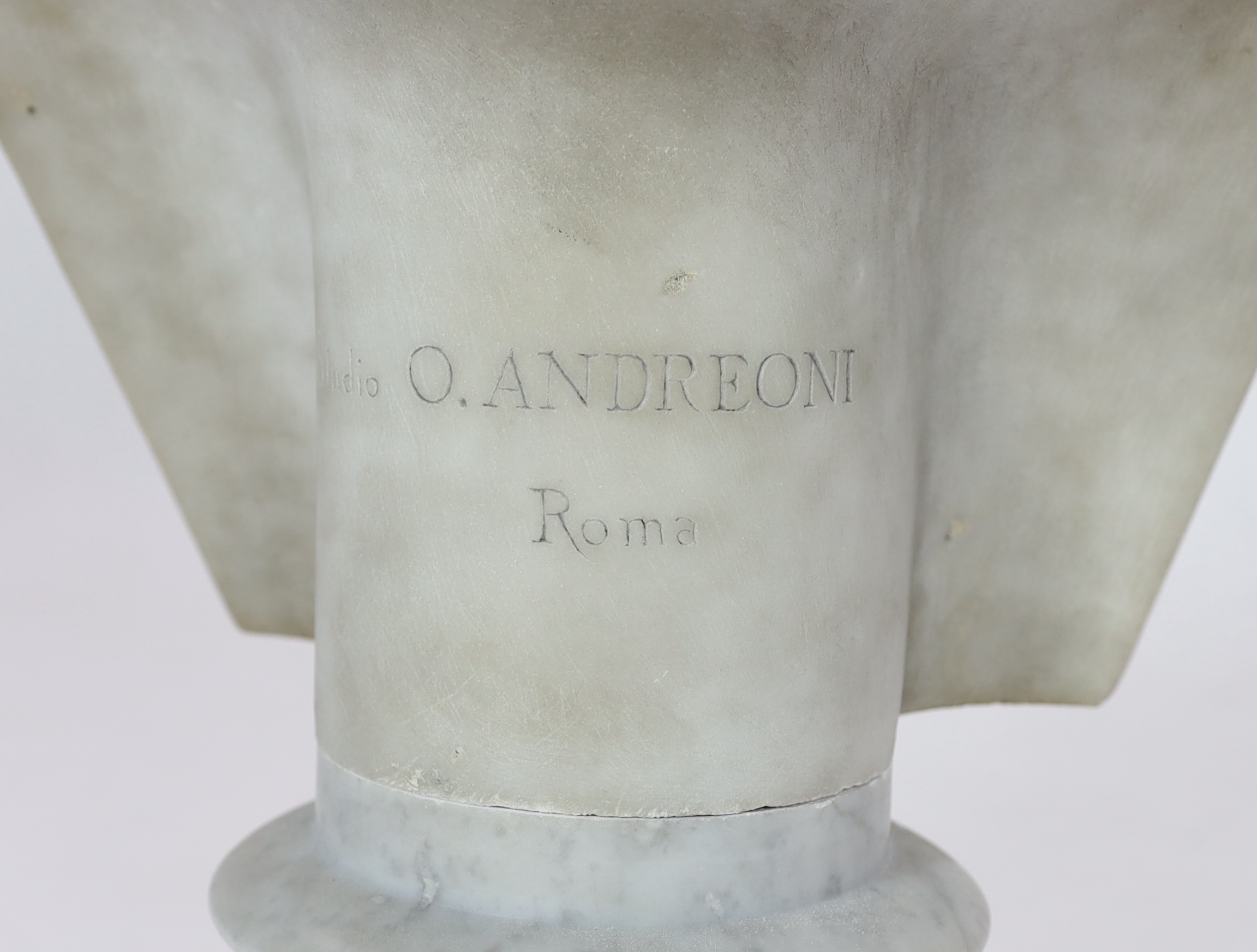 Studio of Orazio Andreioni (c.1840-1895), a 19th century Italian white marble bust of a Roman Emperor, possibly Tiberius, 41cm wide, 30cm deep, overall 75cm high, Please note this lot attracts an additional import tax of